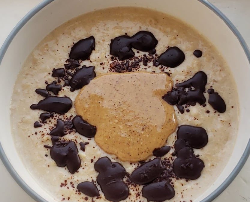 Salted Caramel Protein Porridge topped with Dark Chocolate & Peanut Butter